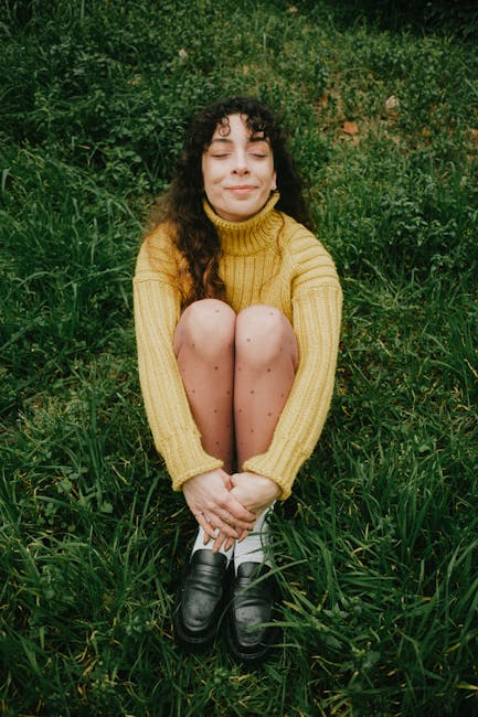 A happy woman in cozy clothes enjoying a moment of calm